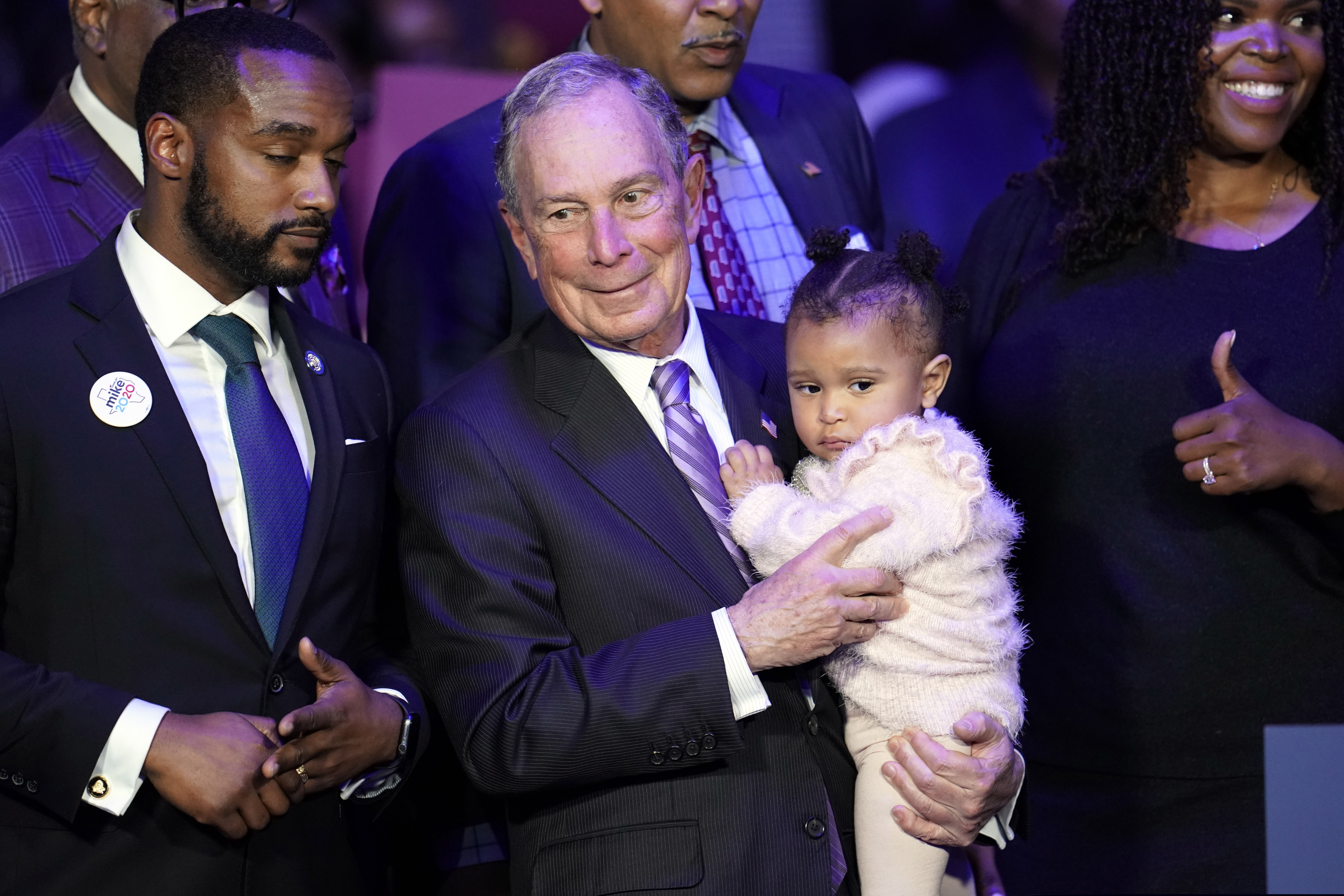 (AP Photo/David J. Phillip) Democratic presidential candidate and former New York City Mayor Michael Bloomberg is joined on stage by supporters during his campaign launch of "Mike for Black America," at the Buffalo Soldiers National Museum, Thursday, Feb. 13, 2020, in Houston.