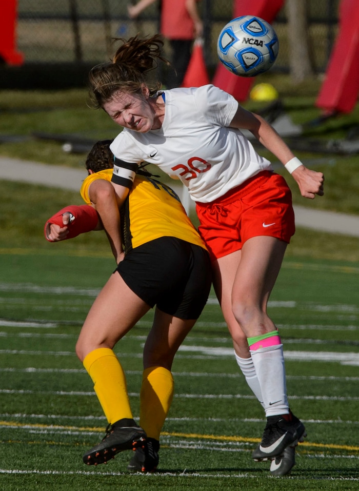 (Steve Griffin | The Salt Lake Tribune) East's Catherine Hill, right, gets tangled up with Maple Mountain's Julia Dean during the 5A semifinal girl's soccer match at Juan Diego High School in Draper Tuesday October 17, 2017.