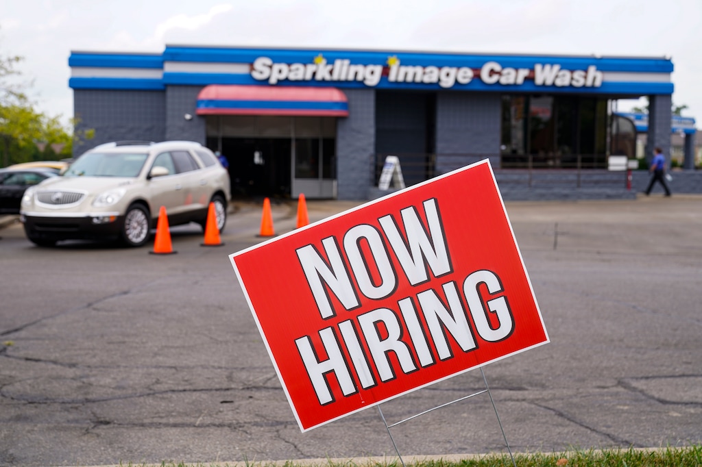 (Michael Conroy | AP) A help wanted sign is displayed at car wash in Indianapolis. U.S. employers advertised more jobs but hired fewer workers in July, sending mixed signals about a job market in the wake of the coronavirus outbreak. The Labor Department said Thursday more than 857,000 workers across the country filed new claims for state unemployment insurance last week, before seasonal adjustments, a slight increase from the previous week. Utah's unemployment numbers, meanwhile, continued to decline.