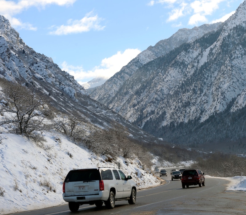 (Al Hartmann  |  Tribune file photo) Traffic travels up Little Cottonwood Canyon after a winter storm.