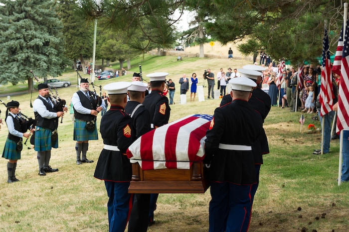 (Alex Gallivan  |  Special to The Tribune) Marine Pfc. Robert K. Holmes, who died 77 years ago aboard the USS Oklahoma during the attack on Pearl Harbor, is laid to rest in the Salt Lake City Cemetery, Monday, Aug. 20, 2018.