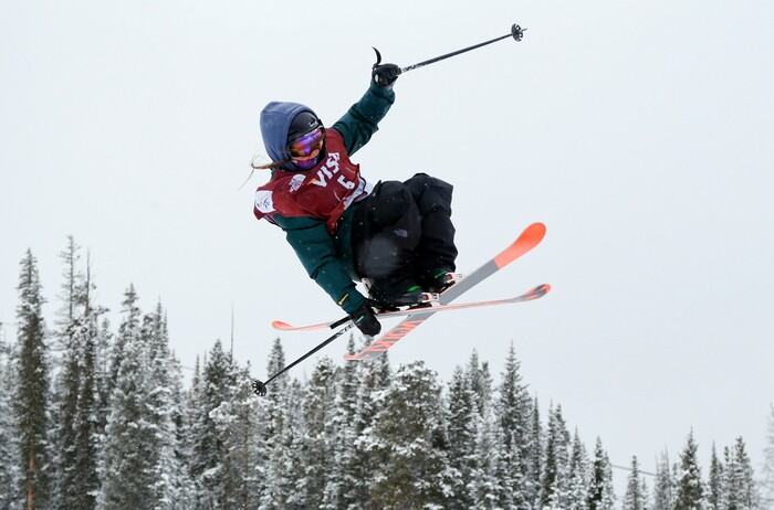 Darian Stevens reaches for a ski off a jump during the World Cup U.S. Grand Prix slope style freestyle skiing finals, Saturday, Dec. 21, 2013, in Frisco, Colo. Stevens placed second in the event. (AP Photo/Julie Jacobson)
