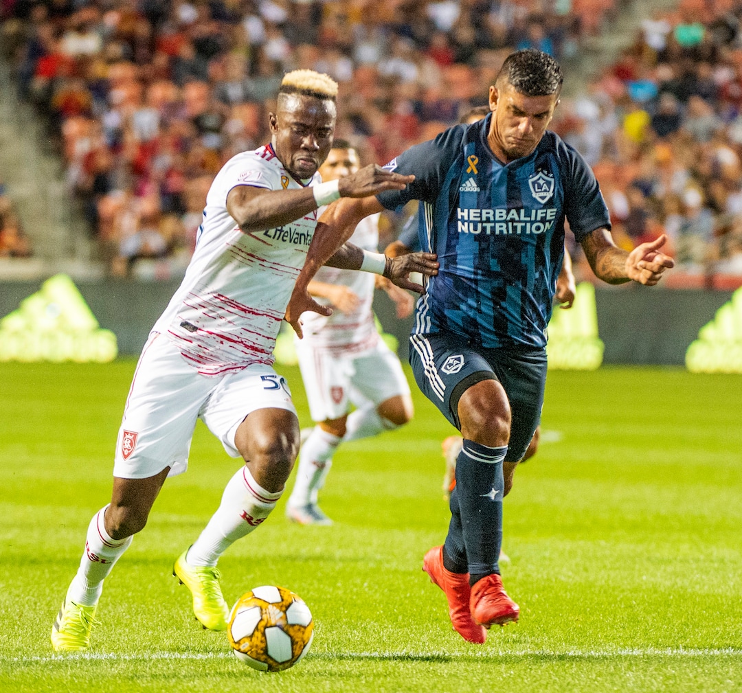 (Rick Egan  |  The Salt Lake Tribune)    Real Salt Lake forward Sam Johnson (50) brings the ball down field as Los Angeles Galaxy defender Diego Polenta (3) defends, in MLS soccer action between Real Salt Lake and Los Angeles Galaxy at Rio Tinto Stadium, Wednesday, Sept. 25, 2019.