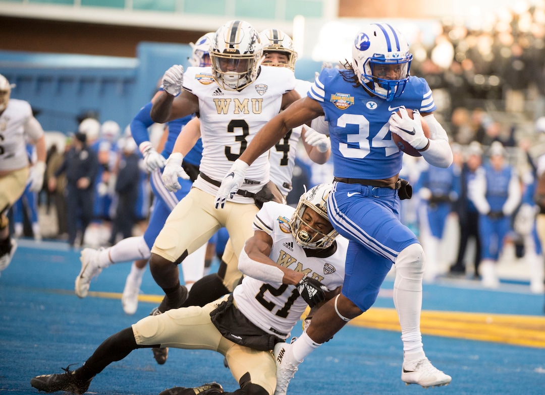(Jeremy Harmon  |  The Salt Lake Tribune) Brigham Young Cougars running back Riley Burt (34) breaks away for a touchdown as BYU faces the Western Michigan Broncos in the Famous Idaho Potato Bowl in Boise, Idaho, on Friday, Dec. 21, 2018.