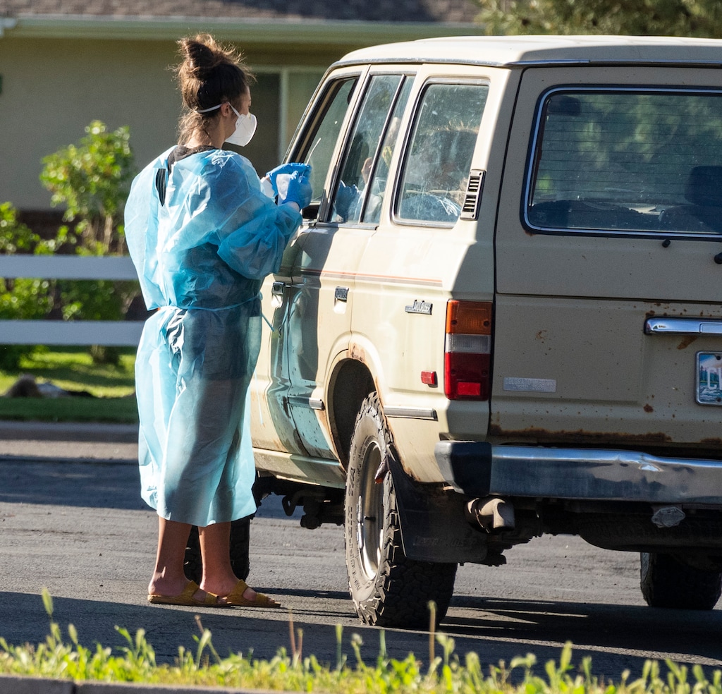 (Rick Egan | The Salt Lake Tribune)  A nurse from test Utah tests for Covid-19 in the parking lot of the South East Health Department, in Moab, on Friday, May 14, 2021.