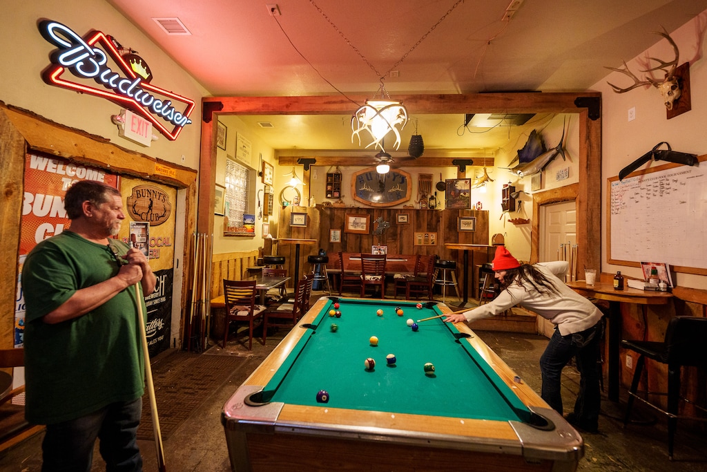 (Trent Nelson  |  The Salt Lake Tribune) Odie Roberts and Amanda Cordova playing pool at Bunny's Club in Coalville on Tuesday, March 14, 2023. Bunny's Club is one of the oldest continuously operating bars in Utah, The Salt Lake Tribune found.