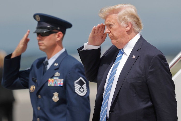 President Donald Trump returns a salute upon his arrival at Hagerstown Regional Airport in Hagerstown, Md., on Air Force One, Friday, Aug. 18, 2017, en route to nearby Camp David, for a meeting with his national security team to discuss strategy for South Asia, including India, Pakistan and the way forward in Afghanistan. (AP Photo/Pablo Martinez Monsivais)