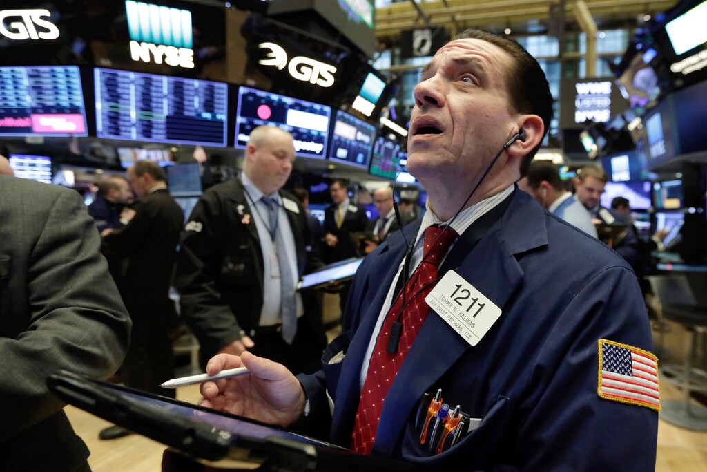 (Richard Drew | The Associated Press) Trader Tommy Kalikas works on the floor of the New York Stock Exchange, Monday, April 2, 2018. U.S. stocks are skidding Monday morning after China raised import duties on U.S. pork, apples and other products.