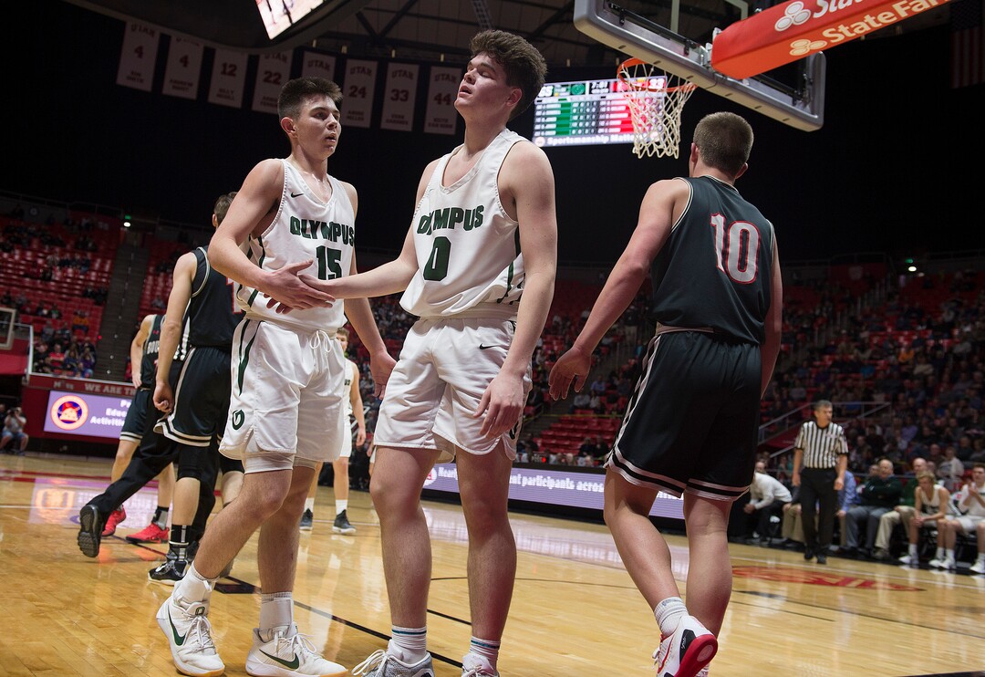 Scott Sommerdorf | The Salt Lake TribuneRylan Jones gives Jeremy DowDell a hand slap after DowDell took a spill during a second half trip to the hoop. Olympus beat Bountiful 79-43, in a boy's 5A semi-final, FrIday, March. 2, 2018.