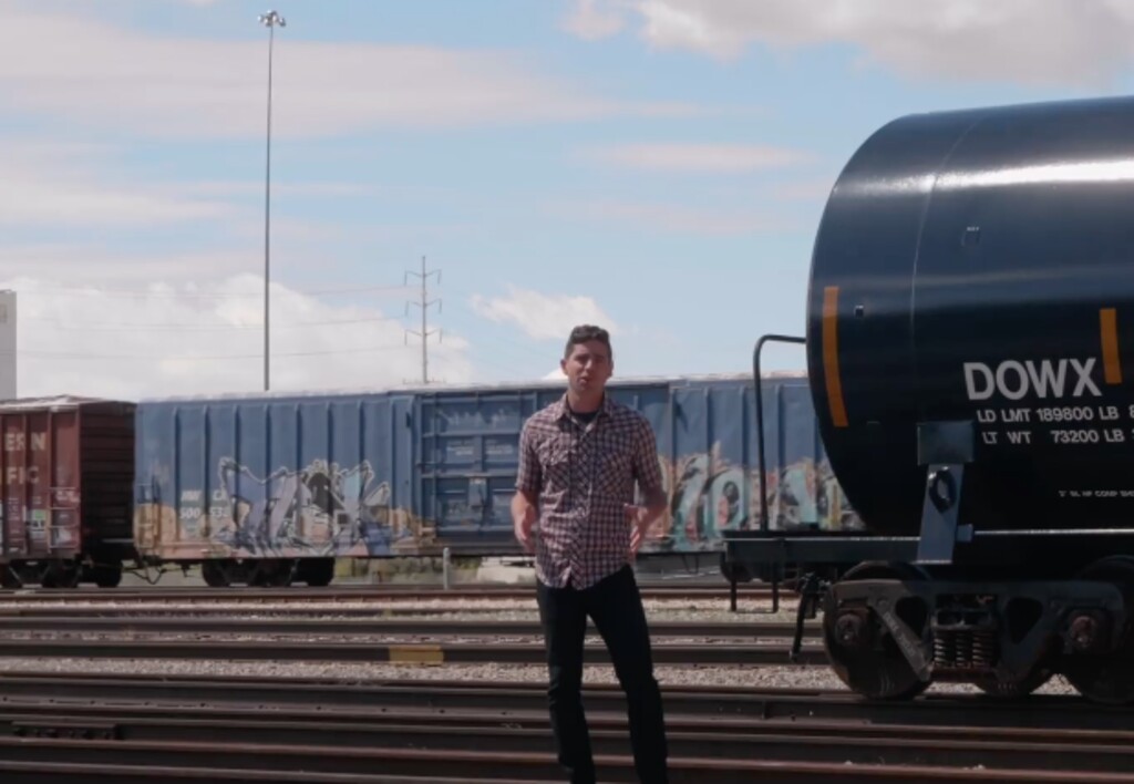 (Screenshot from David Garbett campaign video) Salt Lake City mayoral candidate David Garbett stands in front of a railroad track in a recent video outlining his stronger stance in opposition to the inland port, a massive distribution hub planned for roughly one-third of the city's land mass.