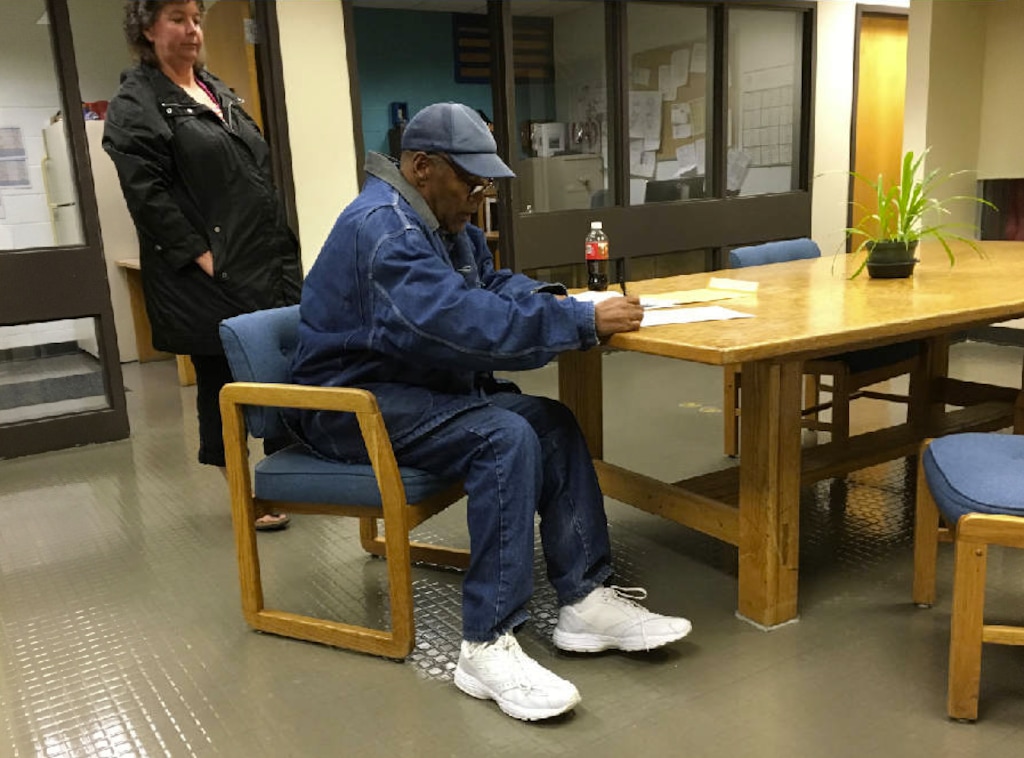 Photo courtesy of Nevada Department of Corrections. Former football legend O.J. Simpson signs documents at the Lovelock Correctional Center, Saturday, Sept. 30, 2017, in Lovelock, Nev. Simpson was released from the Lovelock Correctional Center in northern Nevada early Sunday, Oct. 1, 2017.
