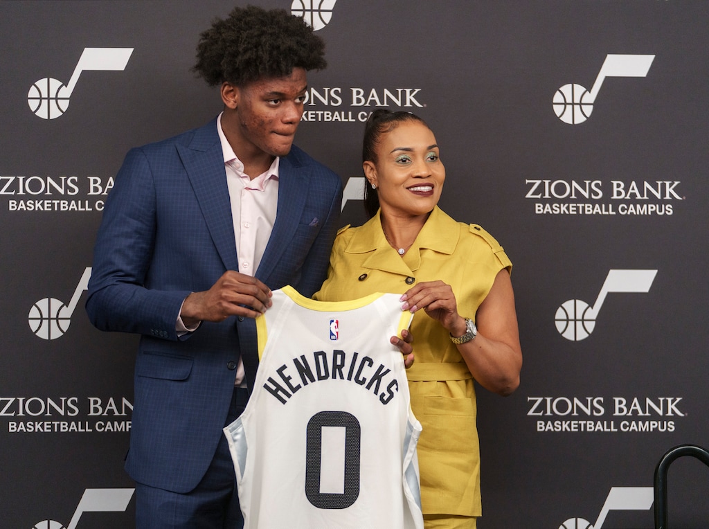 (Leah Hogsten | The Salt Lake Tribune) Taylor Hendricks, the No. 9 Utah Jazz NBA draft pick, poses for photos with his mother Danielle Hendricks and his jersey at the Utah Jazz Basketball Center, June 26, 2023. 