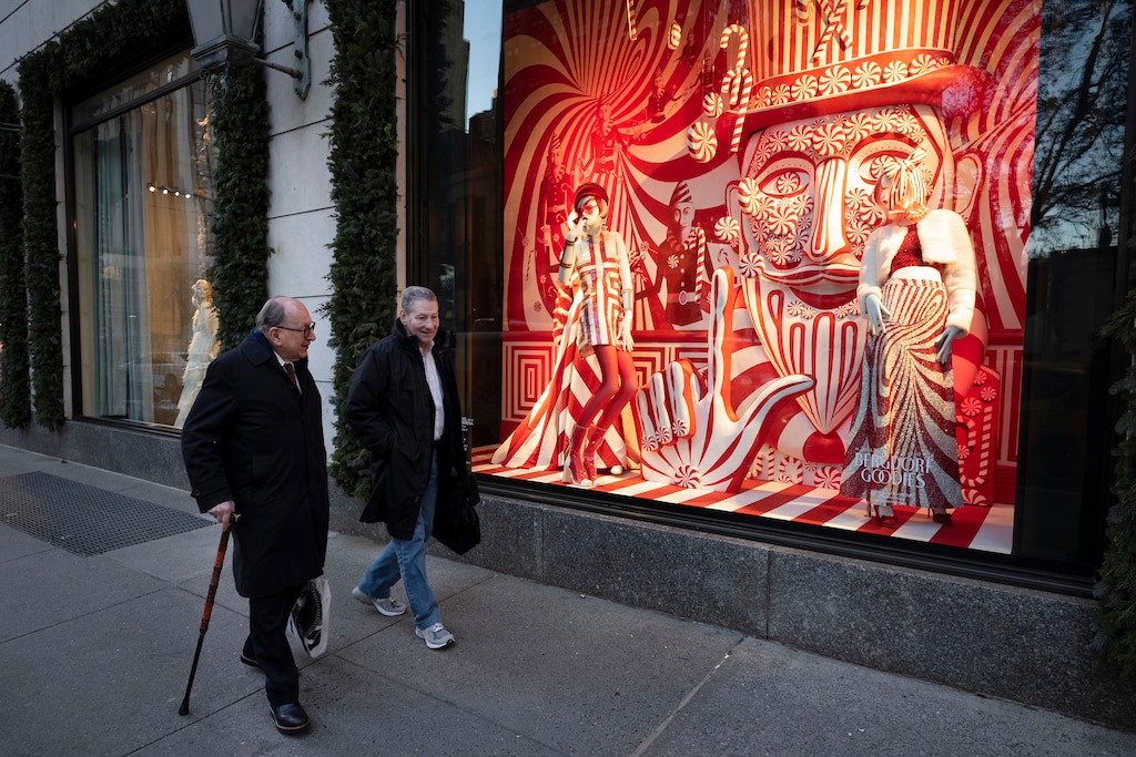 (Mark Lennihan | AP file photo) Men walk past a holiday window at the Bergdorf Goodman store, in New York. E. Jean Carroll, a New York-based advice columnist claims Donald Trump sexually assaulted her in a dressing room at the Manhattan department store in the mid-1990s. The first-person account was published Friday, June 21, in New York magazine. Trump denied the allegations and said “I’ve never met this person in my life.”