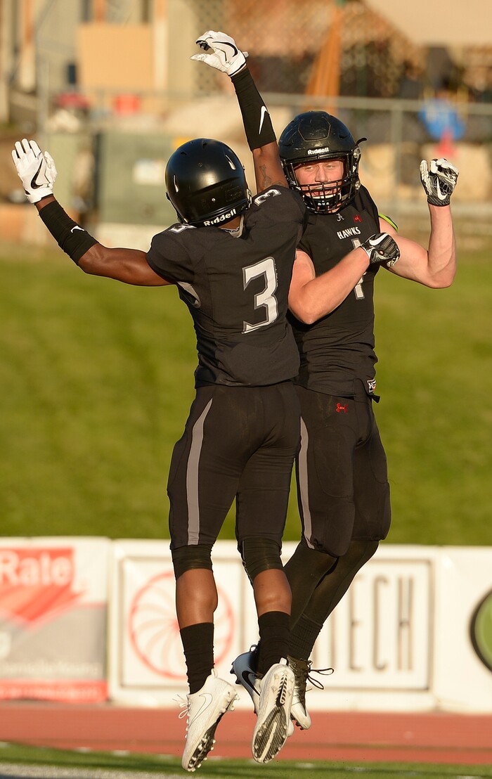 (Leah Hogsten  |  The Salt Lake Tribune) Alta's Zach Engstrom, celebrating with Donovan Spillers, scored two touchdowns in the first half. Lehi High School leads Alta High School 35-21 at the half during their game, Friday, August 18, 2017 in Sandy. 