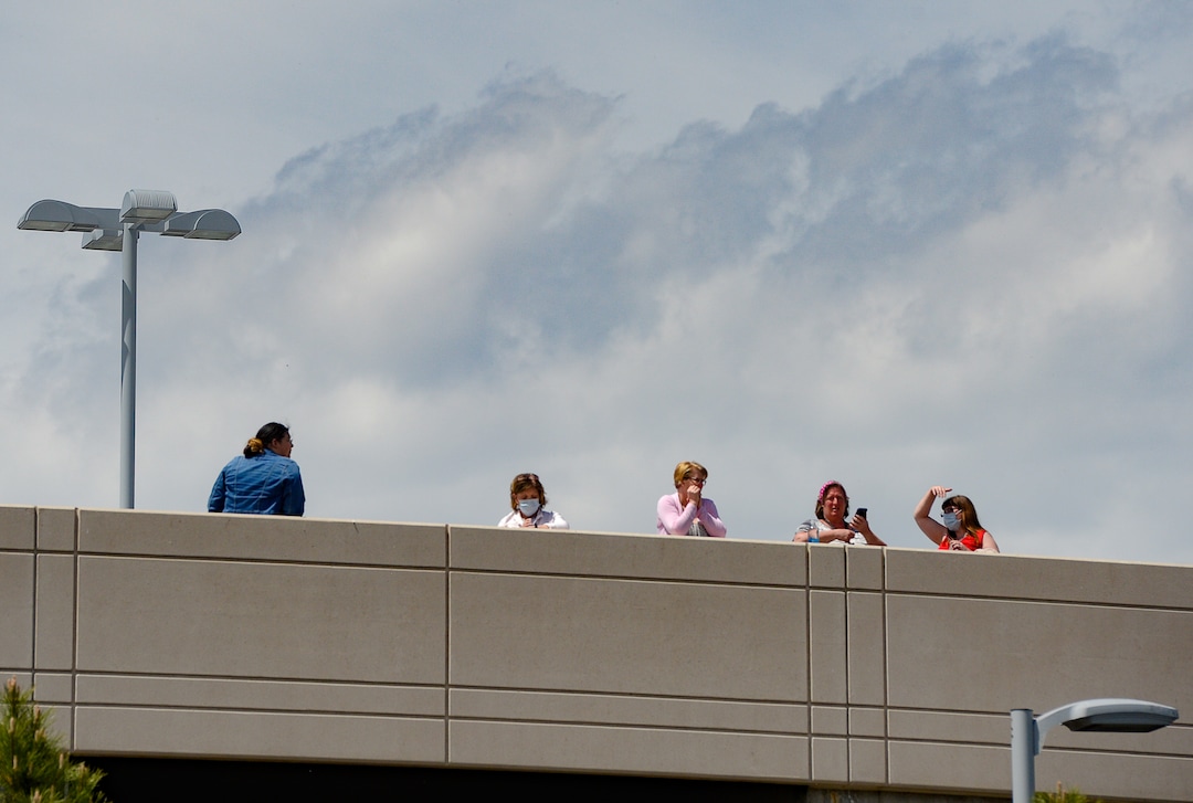 (Francisco Kjolseth  |  The Salt Lake Tribune) People gather  on the rooftop of Intermountain Medical Center in Murray in anticipation of a flyover by the Air Force F-35A Lightning II Demonstration and 388th Fighter Wing, based at Hill Air Force Base, on Thursday, April 30, 2020. The demonstration over Utah was a "salute to everyone on the front lines in the fight against COVID-19, as well as those staying at home to flatten the curve of the virus," according to a news release.