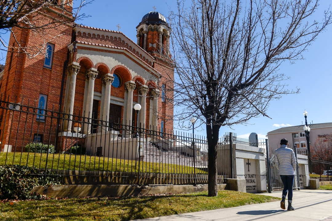 (Leah Hogsten  |  The Salt Lake Tribune) Worshippers in the Greek Orthodox Church of Greater Salt Lake on Sunday endorsed talks with Salt Lake City-based Woodbury Corp. on a partnership to develop choice downtown properties around Holy Trinity Cathedral, at 279 South 300 West. Once at the heart of the city’s Greek Town, the parcels around the historic cathedral total about five acres of land, including several parking lots and the site of the distinct white La France Apartments, a set of about 60 aging row houses east of the church.