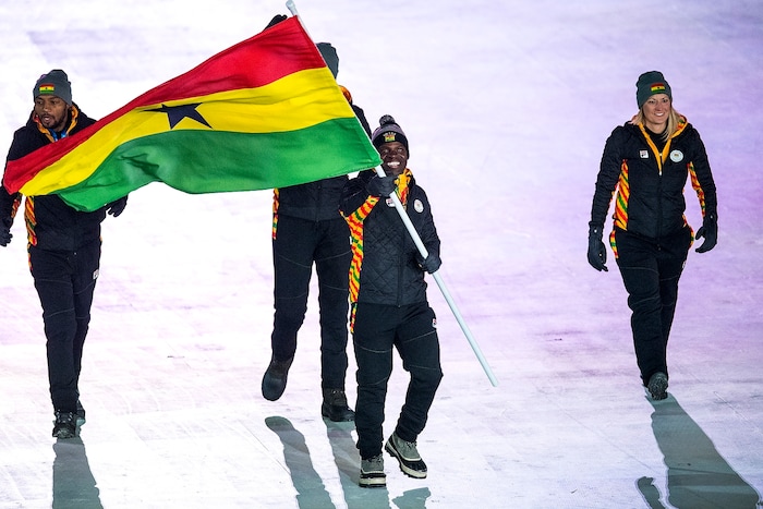(Chris Detrick | The Salt Lake Tribune) Former Utah Valley University sprinter Akwasi Frimpong carries the flag of Ghana during the Pyeongchang 2018 Winter Olympics opening ceremony at Olympic Stadium Friday, February 9, 2018.