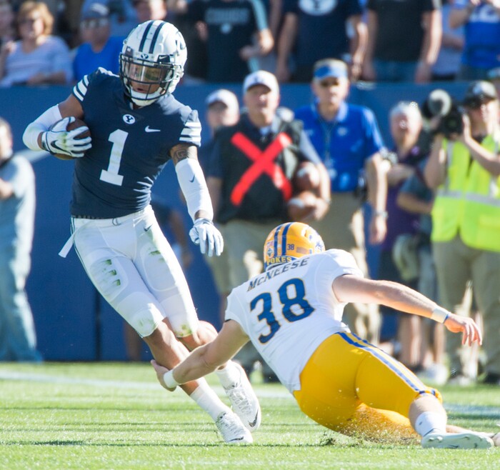 (Rick Egan  |  The Salt Lake Tribune)    Brigham Young Cougars defensive back Troy Warner (1) tries to get past McNeese State Cowboys punter Bailey Raborn (38), after picking up a blocked field goal attempt, in football action Brigham Young Cougars vs McNeese State Cowboys at Lavell Edwards Stadium, Saturday, Sept. 22, 2018.


