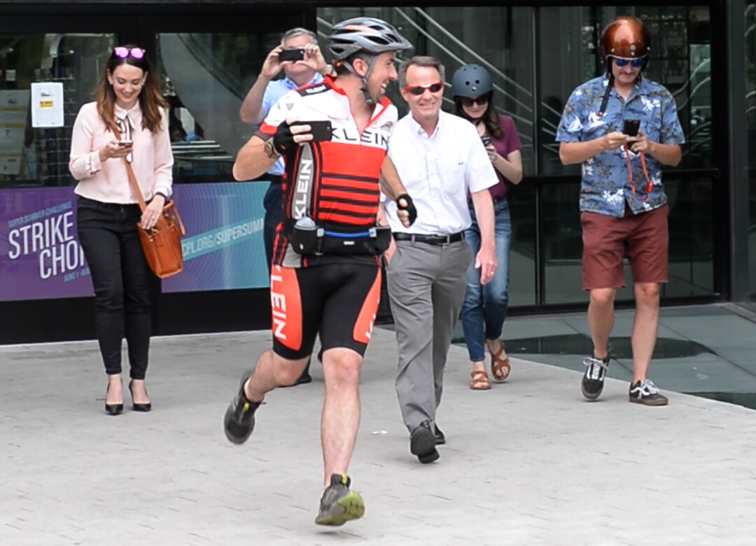 (Rick Egan  |  The Salt Lake Tribune)       Salt Lake Tribune reporters and editors leave Library Square at the start of a race against colleagues in a transportation race from Library Square to the Tribune building at the Gateway on Thursday, Aug. 2, 2018. 