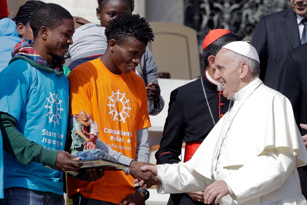 (AP Photo/Andrew Medichini) Pope Francis meets a group of migrants, during his weekly general audience, at the Vatican, Wednesday, Sept. 27, 2017. Pope Francis on Wednesday launched a two-year activism and awareness-raising campaign about the plight of migrants to counteract mounting anti-immigrant sentiment in the U.S., Europe and beyond.