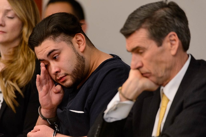 (Trent Nelson | The Salt Lake Tribune)  Abraham Miranda listens to statements from victims and their families at his sentencing in Salt Lake City, Thursday December 21, 2017. Miranda, 19, pleaded guilty to manslaughter counts for a February crash that killed two of his West High School classmates and critically injured a pregnant woman and her baby. At right is Miranda's attorney Greg Skordas.