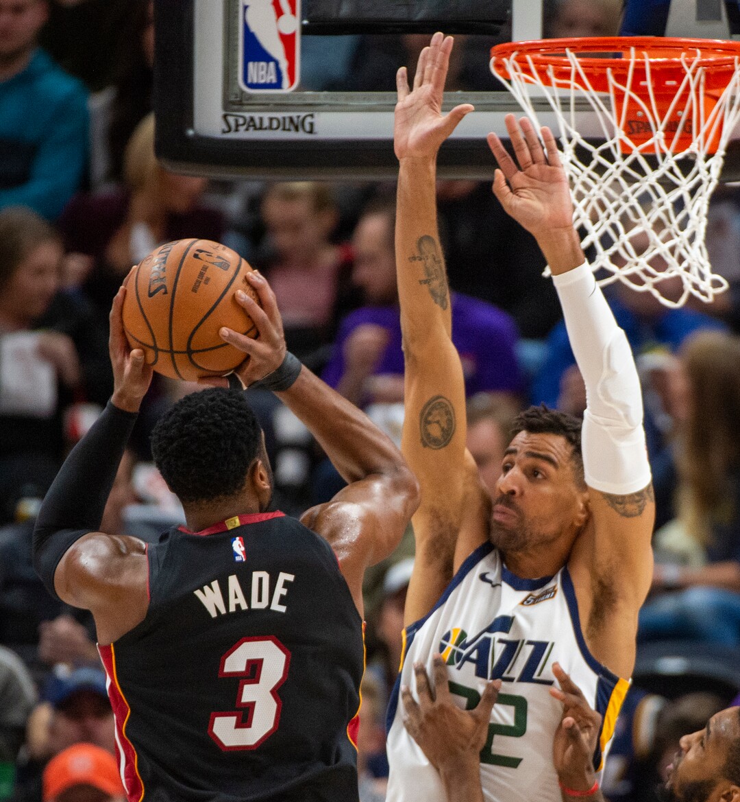 (Rick Egan  |  The Salt Lake Tribune)     Miami Heat guard Dwyane Wade (3) shoots as Utah Jazz forward Thabo Sefolosha (22) defends, in NBA action between Utah Jazz and Miami Heat, at Vivint Smart Home Arena Wednesday, Dec. 12, 2018.