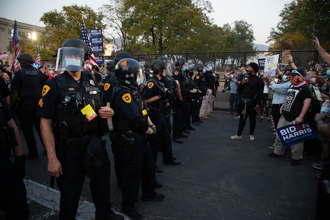 (Francisco Kjolseth  |  The Salt Lake Tribune) Police try to keep supporters and counter protesters of President Donald Trump apart during a rally near Kingsbury Hall on the University of Utah campus in Salt Lake City on Wednesday, Oct. 7, 2020, during the vice presidential debate.