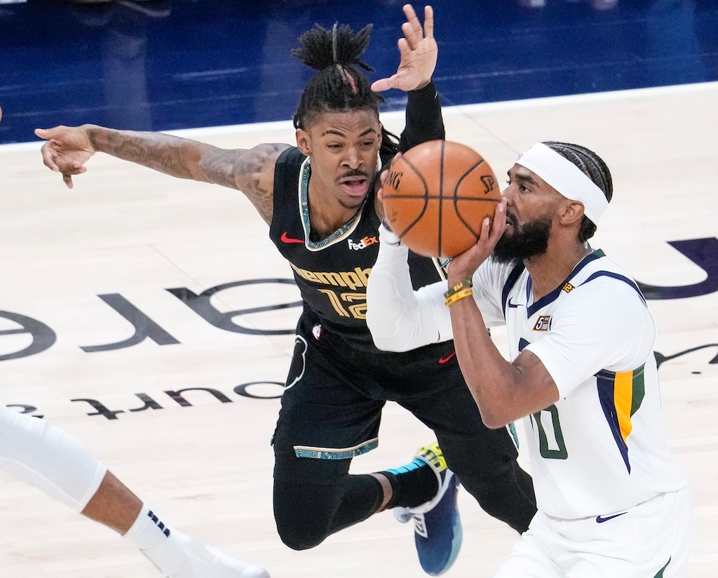 (Leah Hogsten | The Salt Lake Tribune) Memphis Grizzlies guard Ja Morant (12) fouls Utah Jazz guard Mike Conley (10) as the Utah Jazz take on the Memphis Grizzlies during Game 1 of the first-round playoffs at Vivint Arena, May 23, 2021. 