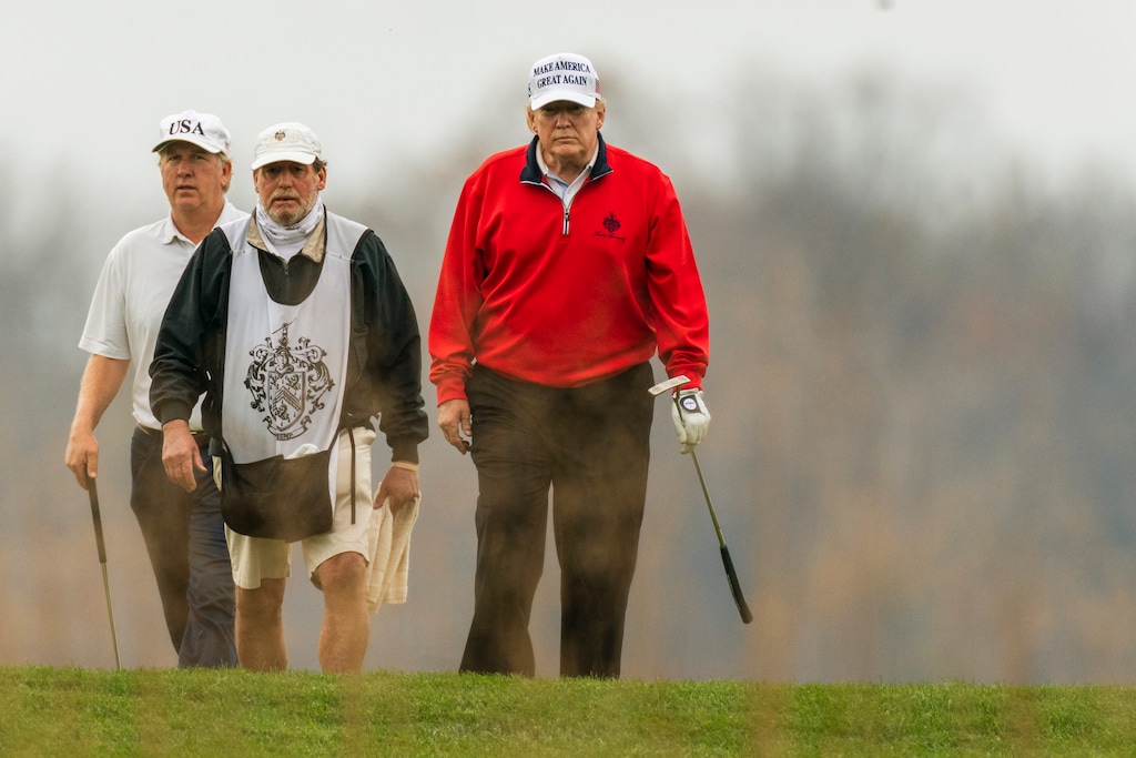 (Manuel Balce Ceneta | AP) President Donald Trump, right, plays golf at the Trump National Golf Club in Sterling, Va., Saturday, Nov. 21, 2020. Trump's "inner circle consists almost exclusively of hyperonline MAGA ideologues, whose passion for American landscapes generally begins and ends at the golf course," writes Stephen Lezak.
