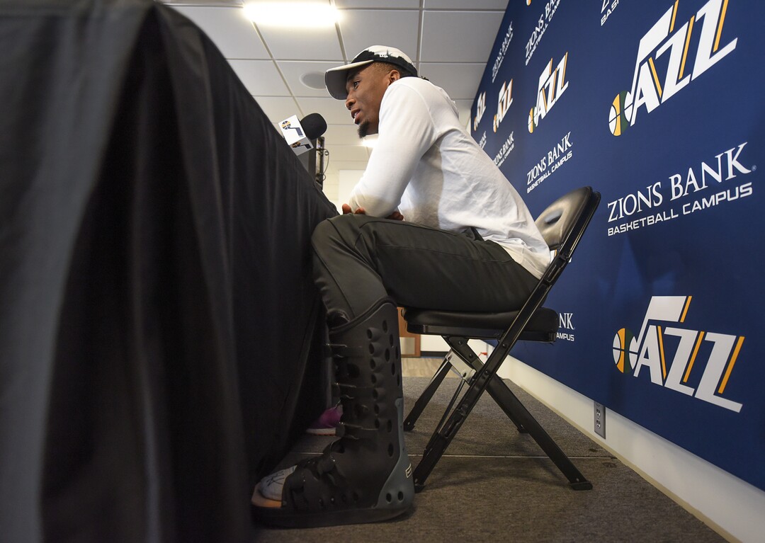 (Francisco Kjolseth  |  The Salt Lake Tribune)  Utah Jazz      guard Donovan Mitchell says his foot is feeling better but wears a boot as a precaution as he speaks with the media during exit interviews at their practice facility in Salt Lake City Wed., May 8, 2018, after losing to the Houston Rockets in game 5 of their Western Conference Semifinals during the 2018 NBA Playoffs.