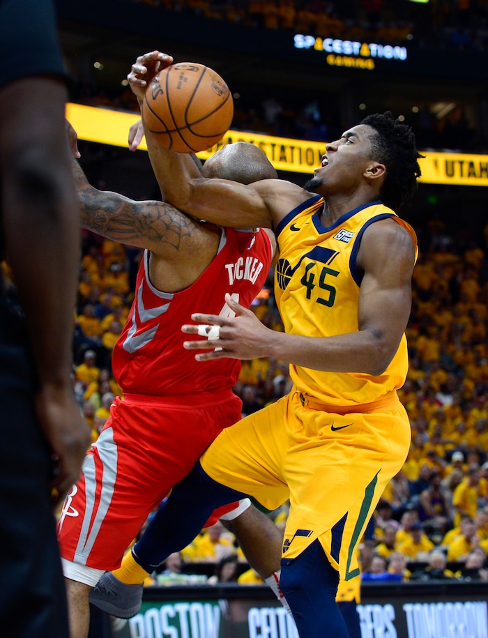 (Scott Sommerdorf | The Salt Lake Tribune)
Utah Jazz guard Donovan Mitchell (45) and Houston Rockets forward PJ Tucker (4) get tangled up going for a loose ball. The Rockets beat the Jazz 100-87, Sunday, May 6, 2018.