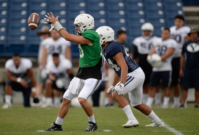 (Francisco Kjolseth  |  The Salt Lake Tribune)  Quarterback Koy Detmer jr. pulls in a high snap as BYU holds a scrimmage at LaVell Edwards Stadium in Provo on Thursday, Aug. 10, 2017.