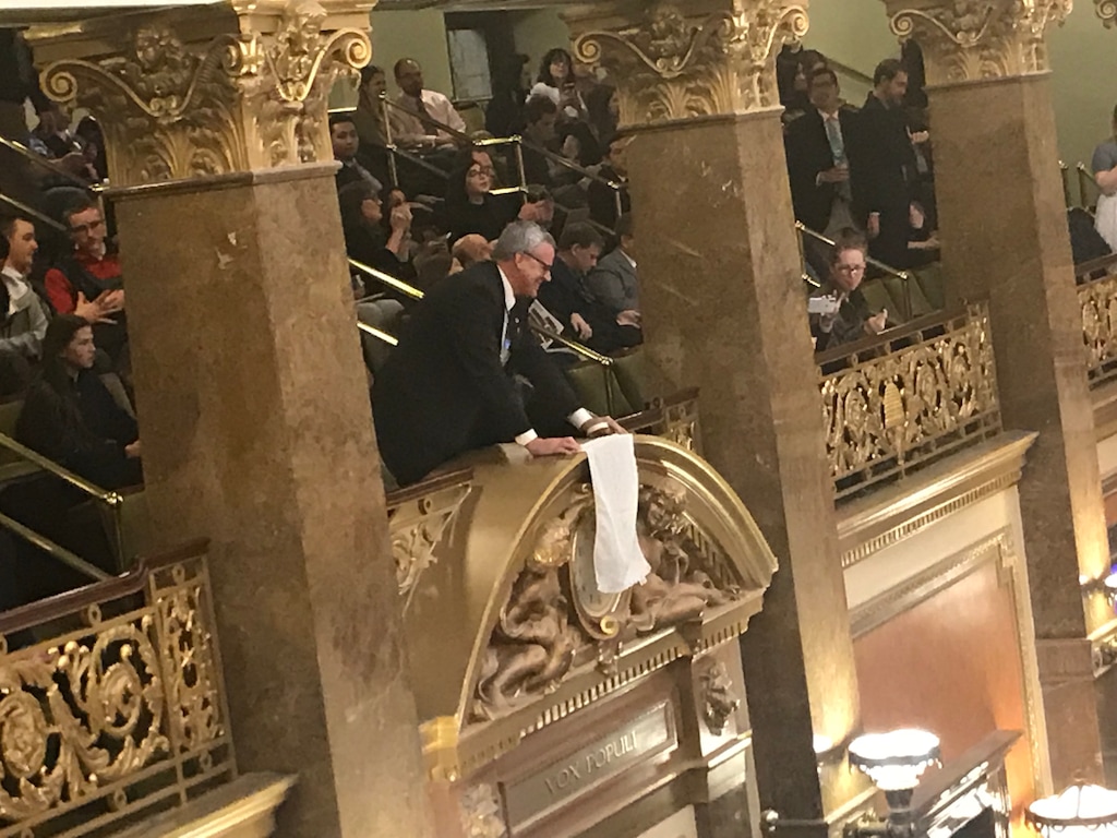 (Benjamin Wood | The Salt Lake Tribune) With only minutes to go until midnight, the absolute deadline for legislative business, Rep. Ed Redd, R-Logan, moved to the House gallery to drape a white cloth over the chamber's clock.