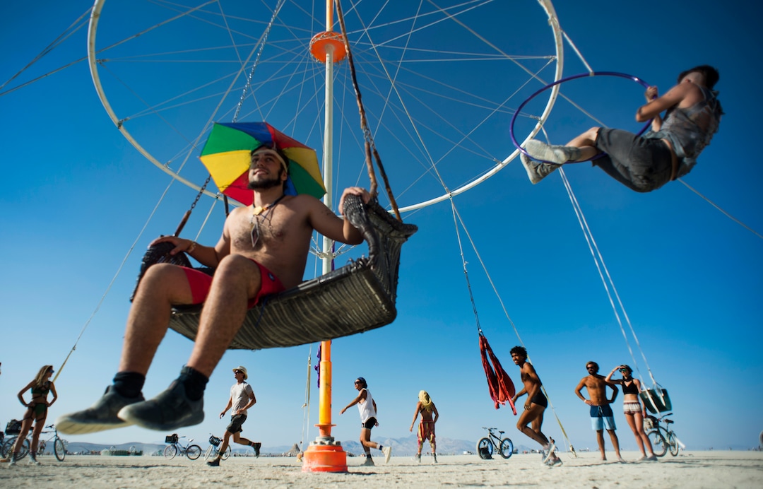 (Rick Egan  |  The Salt Lake Tribune)    Burning Man revelers enjoy a swing, at Burning Man, Friday, August 31, 2018.