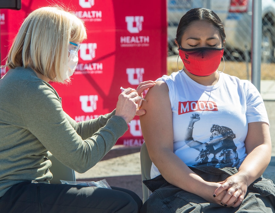 (Rick Egan | The Salt Lake Tribune)  Megan Low adminsiters a Covid 19 vaccination to Margret Maumau, during a news conference, as the Utah Department of Health is announced that they are teaming with Intermountain Healthcare, Nomi Health and University of Utah Health, to open mass vaccination sites for the next phase of COVID-19 vaccinations, on Monday, March 1, 2021.