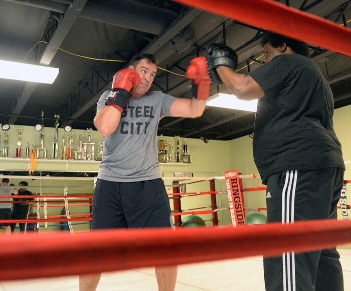 (Al Hartmann | The Salt Lake Tribune)
House Speaker Greg Hughes spars with Eddie "Flash" Newman during his workout at the Flash Academy gym in Holladay Tuesday August 29. He's among a handful of local politicians, police and lobbyists who will box in a series of charity matches to benefit a national group that works to end domestic violence.
