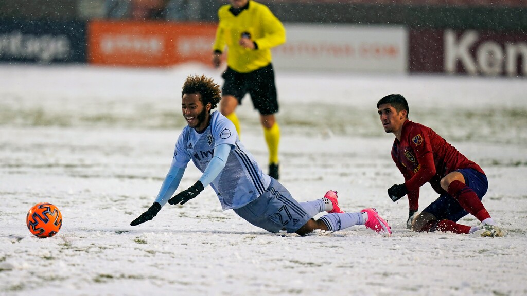 Sporting Kansas City forward Gianluca Busio (27) is taken down by Real Salt Lake midfielder Pablo Ruiz, right, in the first half of an MLS soccer match, Sunday, Nov. 8, 2020, in Sandy, Utah. (AP Photo/Rick Bowmer)