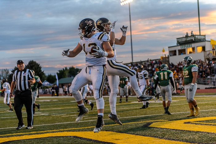 (Trent Nelson | The Salt Lake Tribune) Lone Peak's Masen Wake and Kobe Freeman celebrate a first half touchdown as Kearns hosts Lone Peak, high school football, Thursday September 14, 2017.