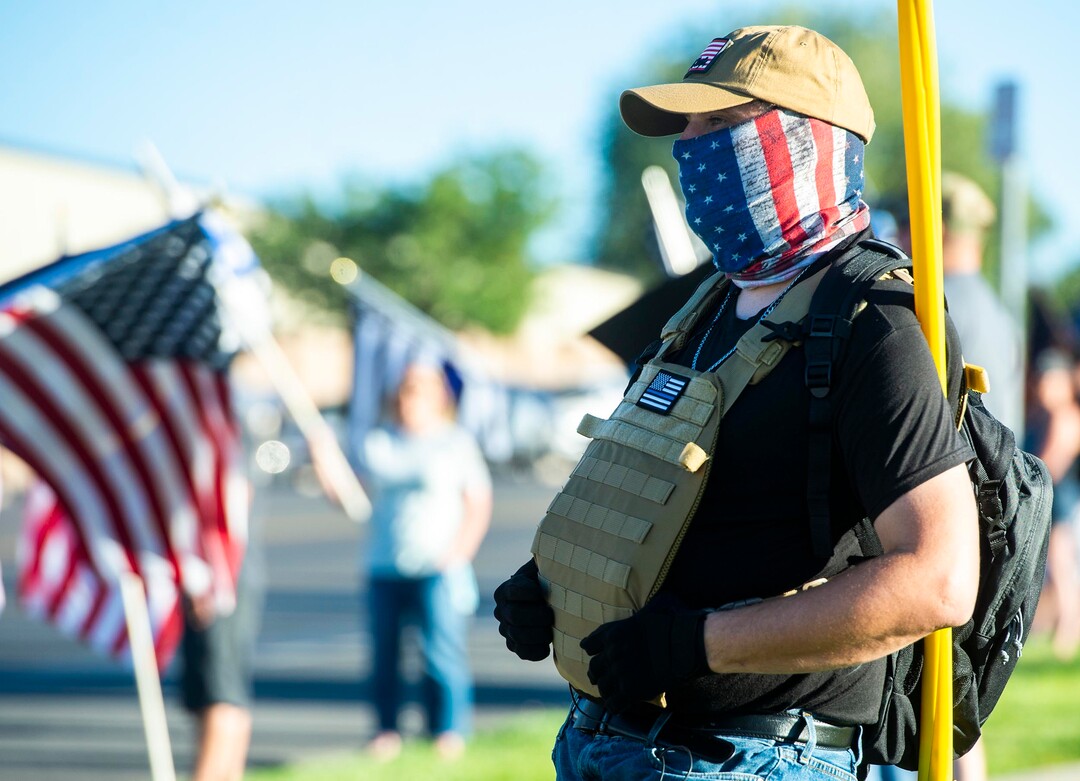 (Rick Egan  |  The Salt Lake Tribune)     Police supporters upset by a Pat Bagley cartoon, wear flags and wave flags as they protest The Salt Lake Tribune in West Valley City, on Thursday, Sept. 3, 2020.