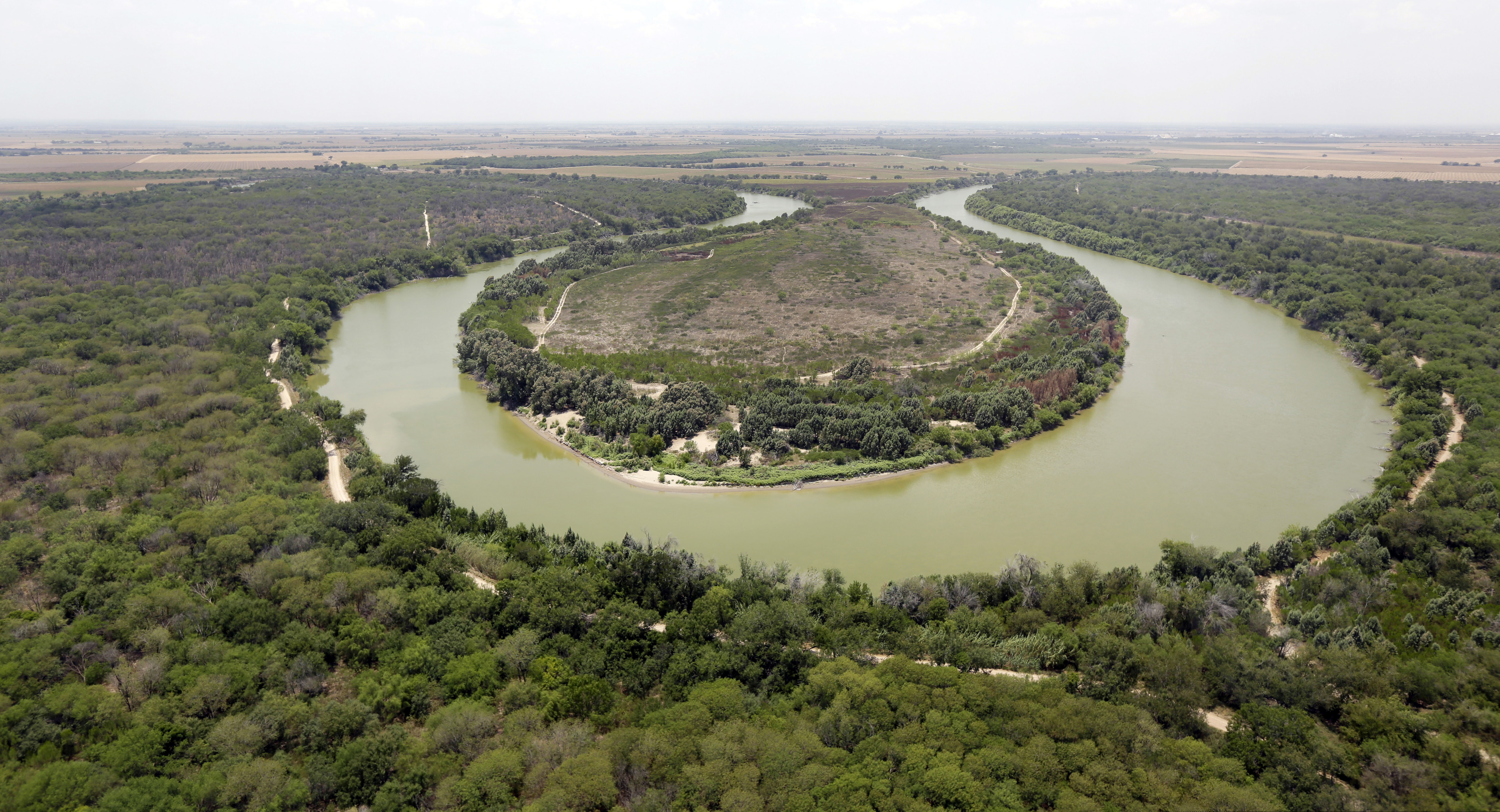(Eric Gay | AP file photo) A bend in the Rio Grand is viewed from a Texas Department of Public Safety helicopter on patrol over in Mission, Texas, in 2014. The U.S. government says a teenage Guatemalan died Monday, May 20, 2019, at a Border Patrol station in South Texas, the fifth death of a migrant child since December. U.S. Customs and Border Protection said in a statement that Border Patrol apprehended the teenager in South Texas' Rio Grande Valley on May 13. The agency says the teenager was found unresponsive Monday morning during a welfare check at the agency's Weslaco, Texas, station. The teenager's cause of death is unknown.