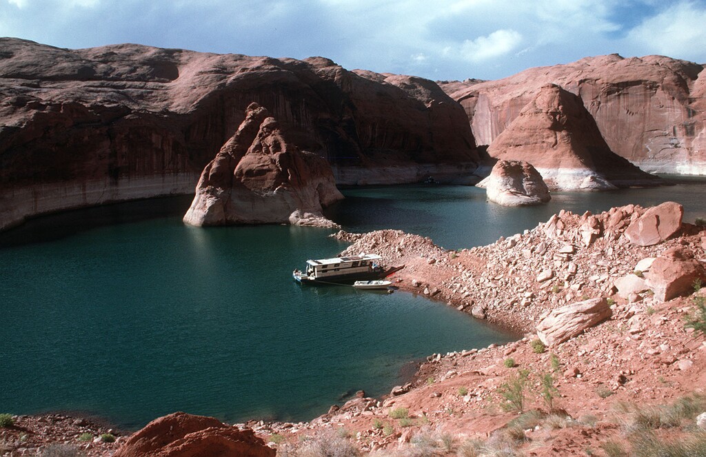 (Tribune File Photo) This file photo shows an anchorage near the mouth of Escalante Canyon on Lake Powell. Friends say a houseboat was traveling to Bullfrog from the Escalante arm of Lake Powell when a man decided to jump off the port side on Saturday, Sept. 22, 2018. The man is presumed dead, and authorities are searching for his body.