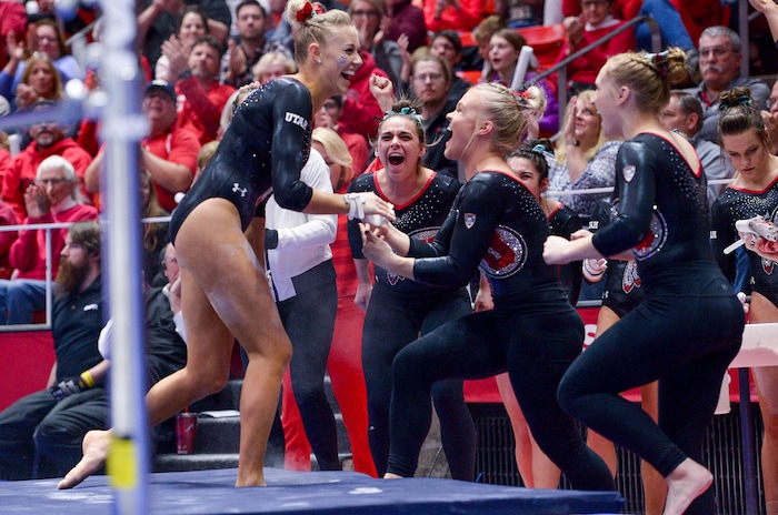 (Leah Hogsten  |  The Salt Lake Tribune) The Red Rocks celebrate MaKenna Merrell-Giles' bars routine as the No. 4 Utah gymnasts host No. 20 Georgia in the final regular season meet at Jon M Huntsman Center in Salt Lake City Friday, March 16, 2018. 