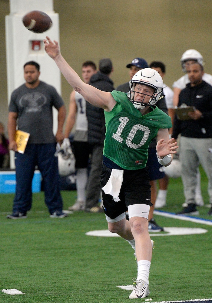 (Al Hartmann | The Salt Lake Tribune)
BYU opened spring football camp on Monday March 5 in the indoor playing facility. Quarterback Joe Critchlow takes his turn running the offense.