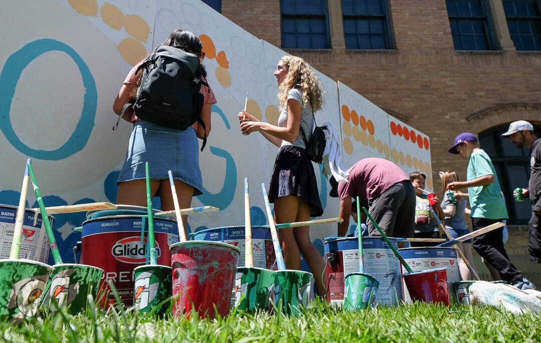 (Francisco Kjolseth  |  The Salt Lake Tribune)  People participate in the creation of a communal Ogden mural as the Ogden Arts Festival brings local and regional artists, creatives and entertainers to Ogden, UT on June 8th and 9th. The Ogden Arts Festival returned to the historic Union Station located in the heart of downtown. Managed by Nurture the Creative Mind and held as a fundraiser for the organization, the event was complete with artist booths, music, theater, kidÕs activities, urban arts area, skateboarding games and artisan food vendors.