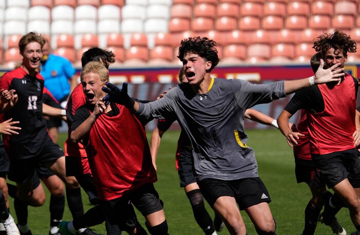 (Francisco Kjolseth | The Salt Lake Tribune) Alta goalie Thiago Moreira (1) celebrates with the team following his clutch saves in shootout during the 5A State Soccer Championship title game over Lehi at Rio Tinto Stadium, Wednesday, May 25, 2022. Alta defeated Lehi in shootout 3-1.