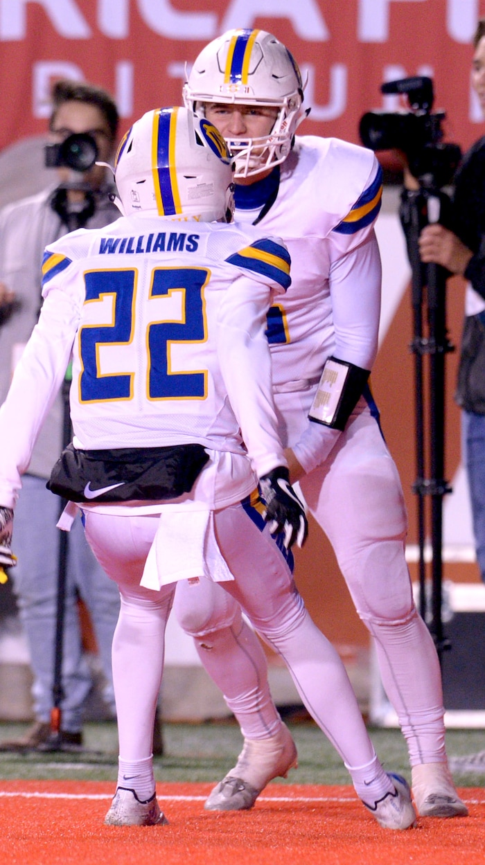 (Leah Hogsten  |  The Salt Lake Tribune)  Orem's quarterback Cooper Legas celebrates his touchdown with Jaxon Williams.  Orem High School defeated Sky View High School 28-12 during their class 4A state semifinal game at Rice-Eccles Stadium, Friday, Nov. 10, 2017.