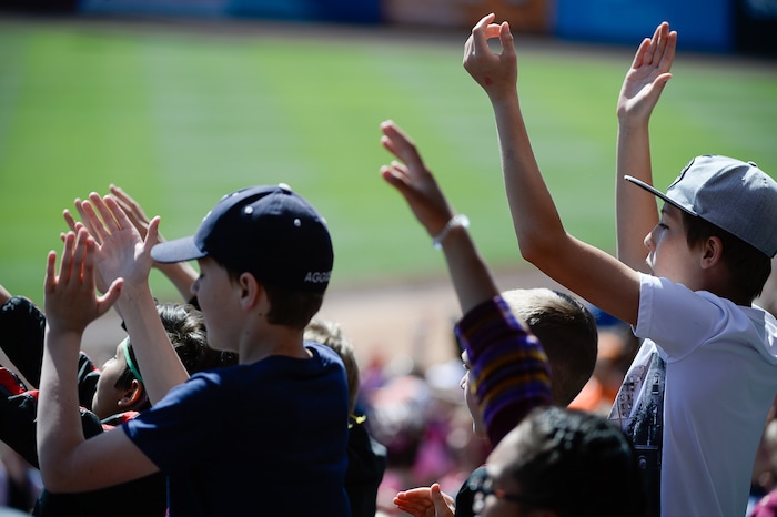 (Francisco Kjolseth  |  The Salt Lake Tribune)  Kids cheer on the game at Smith's Ballpark on Thursday, May 2, 2019 for the staging of their annual kids day baseball game.