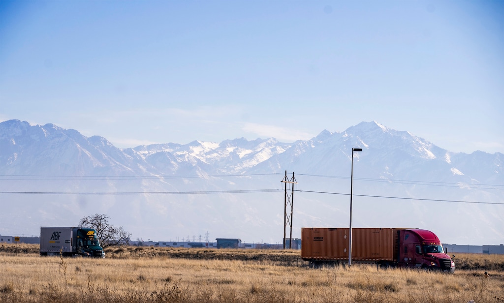 (Rick Egan | The Salt Lake Tribune)  Trucks leave the Salt Lake City Intermodal Terminal, on Tuesday, December 26, 2023. The Utah Department of Environmental Quality was awarded $110 million in federal funding to reduce emissions at the terminal and improve Salt Lake City's air quality, but the agency hasn't spent that money because of uncertainty surrounding Trump's federal funding freeze.