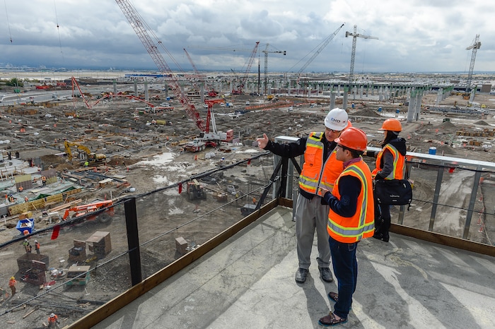 (Francisco Kjolseth  |  The Salt Lake Tribune)  Leon Nelson, center, Construction Director with the Salt Lake City Department of Airports gives a tour of the progress being made to replace the three aging terminals with a single central terminal building. Over time, the existing terminal, parking garage and concourses will be completely demolished and replaced with an estimated completion date of 2025.