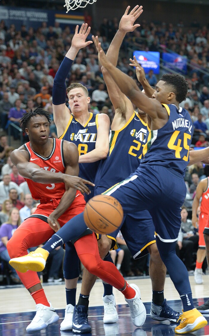 (Leah Hogsten  |  The Salt Lake Tribune) Utah Jazz forward Jonas Jerebko (8), Utah Jazz center Rudy Gobert (27), Utah Jazz guard Donovan Mitchell (45) pressure Toronto Raptors forward OG Anunoby (3) under the net. The Utah Jazz were defeated by the Toronto Raptors 100-109 at Vivint Smart Home Arena, Friday, November 3, 2017